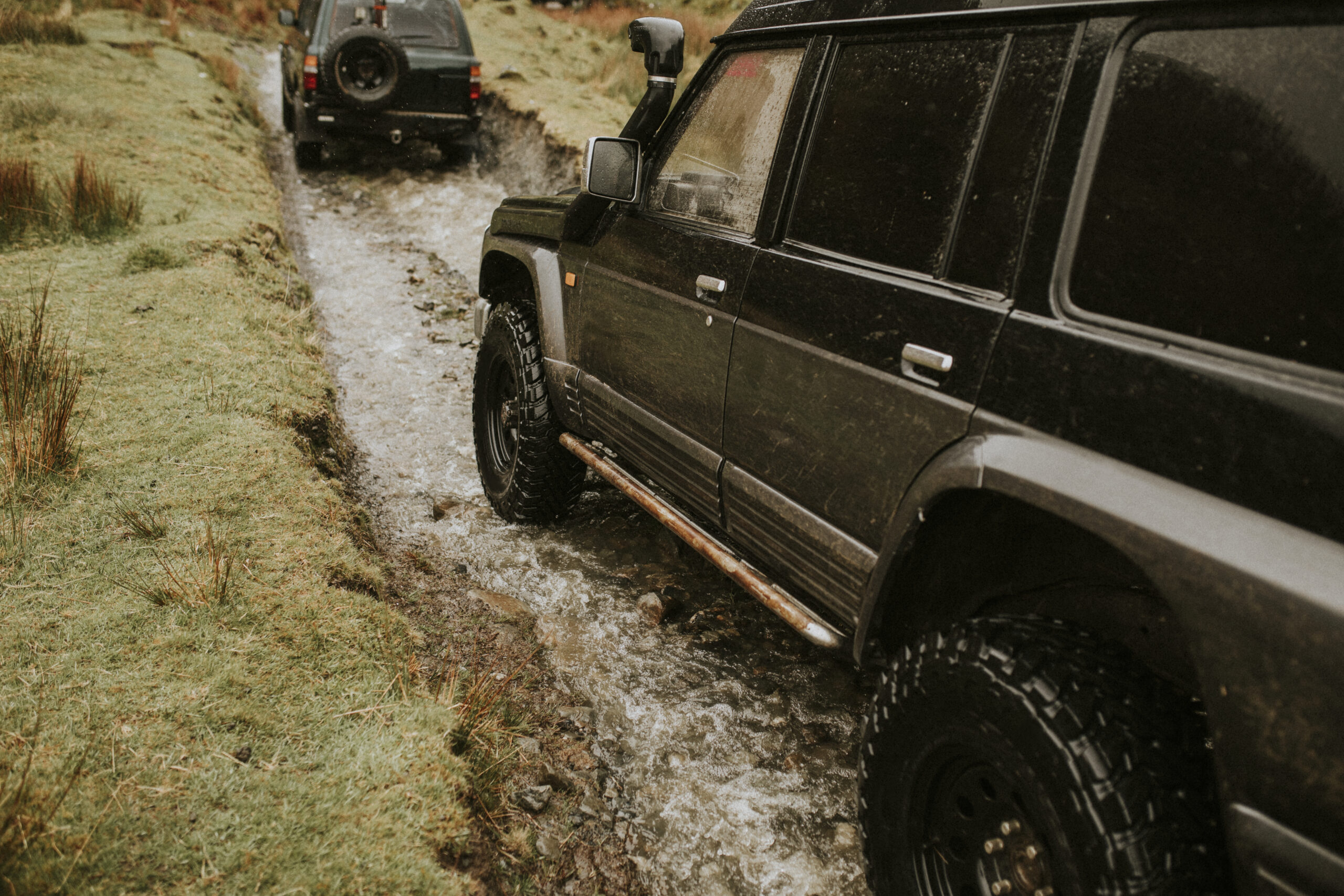 SUV cars off-roading in nature